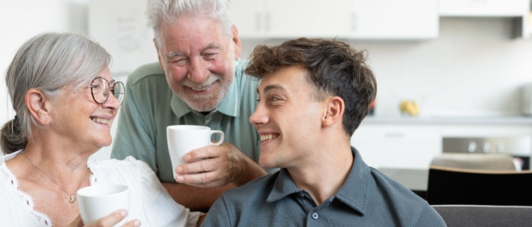 Two grandparents sitting with their grandson