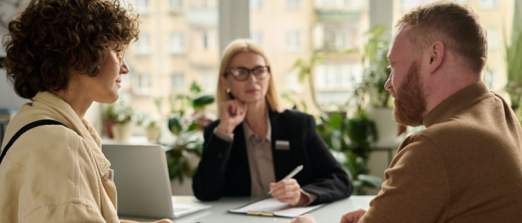 A couple sitting with a financial planner.