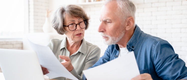 An older couple looking at documents together.