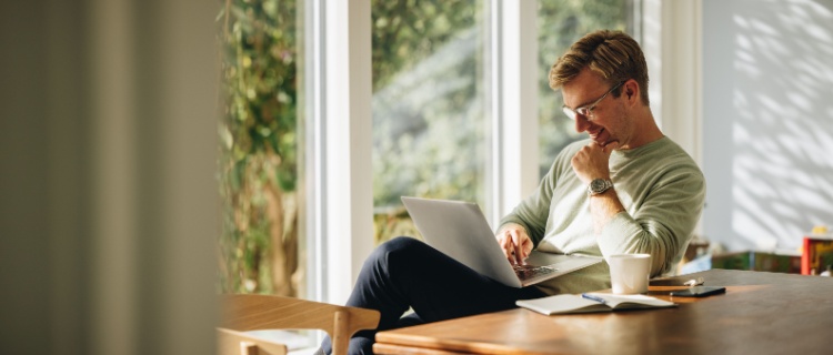A man using his laptop.