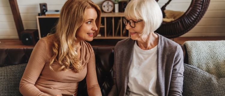 An older woman and her daughter sat together