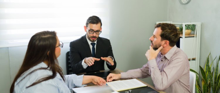 A solicitor meeting with a couple