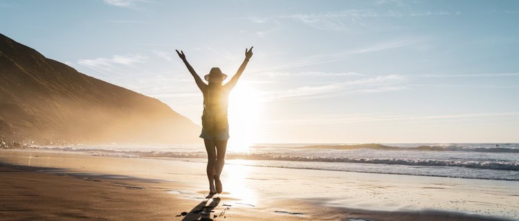 A woman walking on a beach