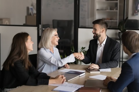 An older client with three professionals